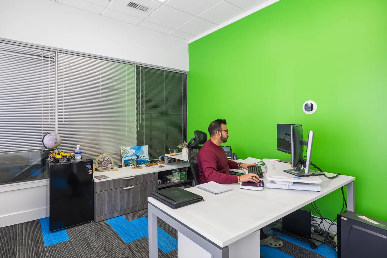 A broker working at their desk